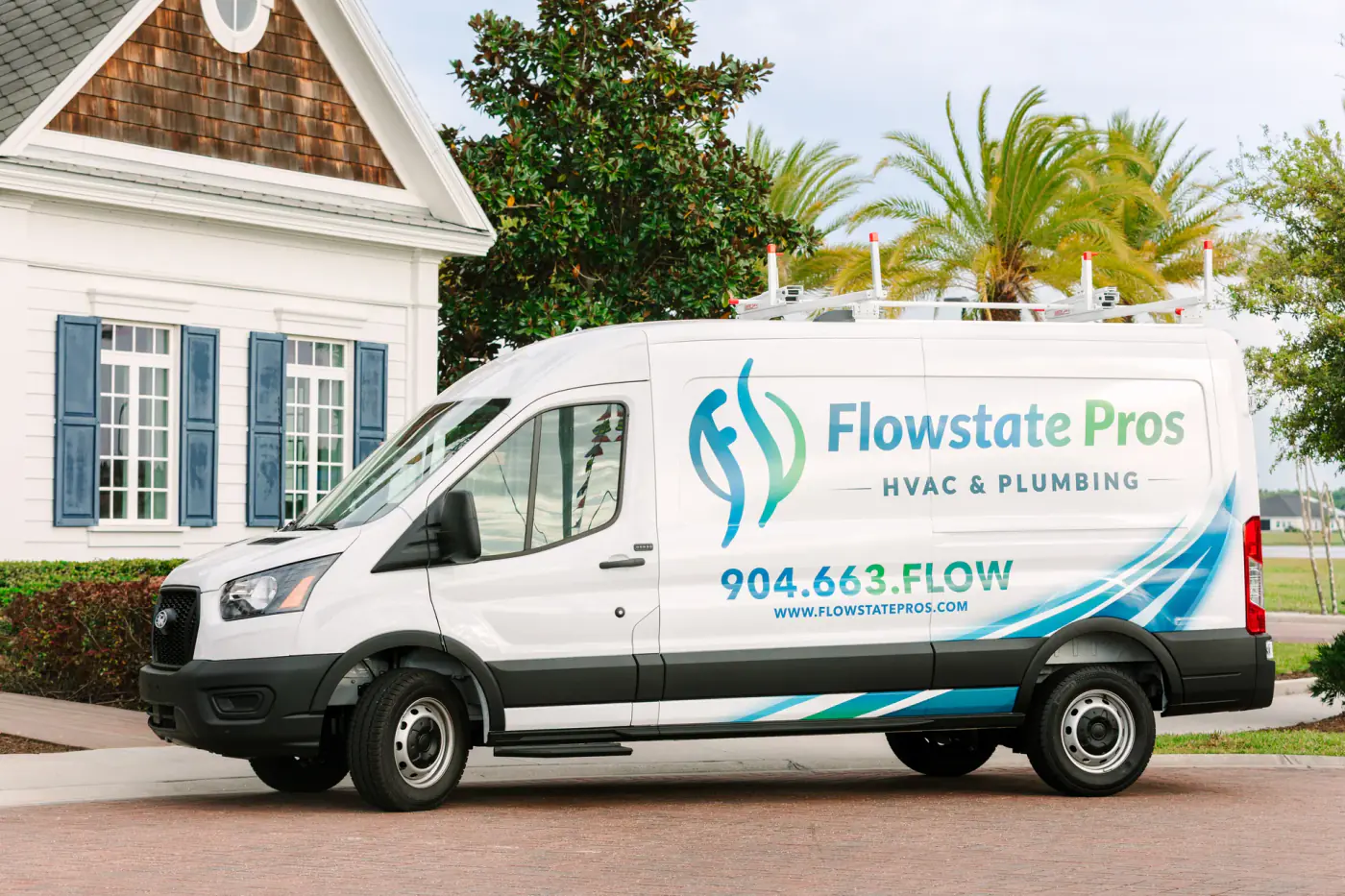 Flowstate Pros service van parked outside a home