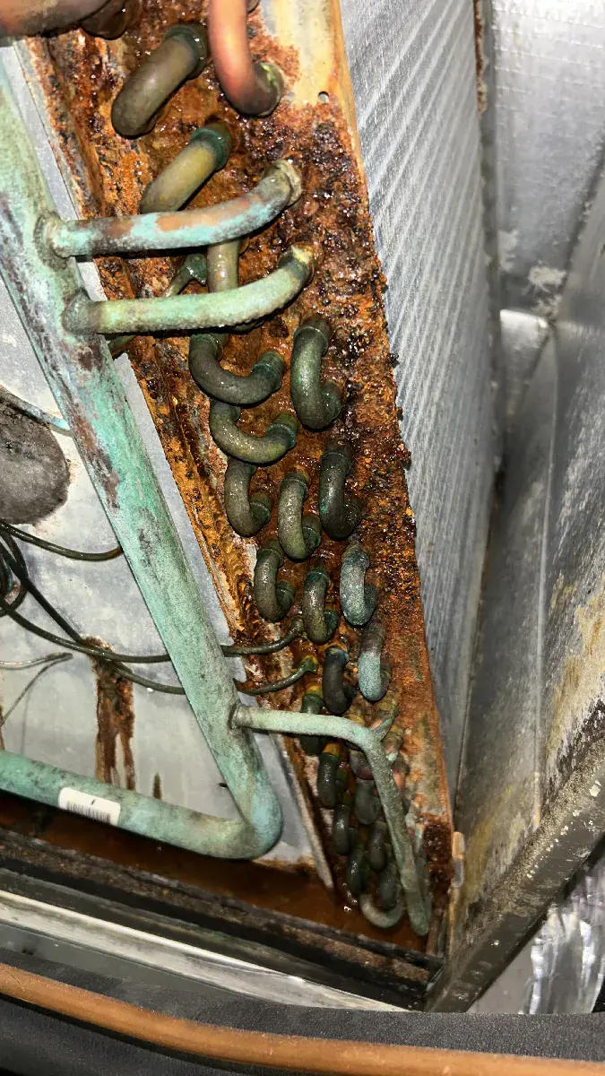 Corroded evaporator coil requiring replacement
