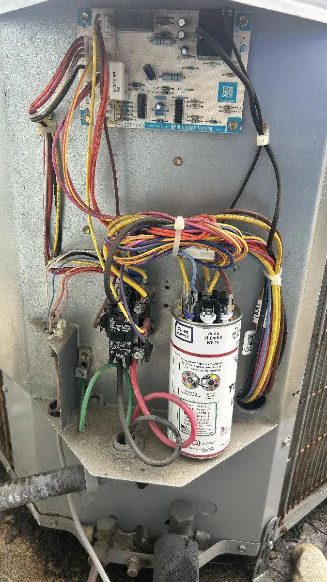 AC condenser unit open for repair and diagnostics