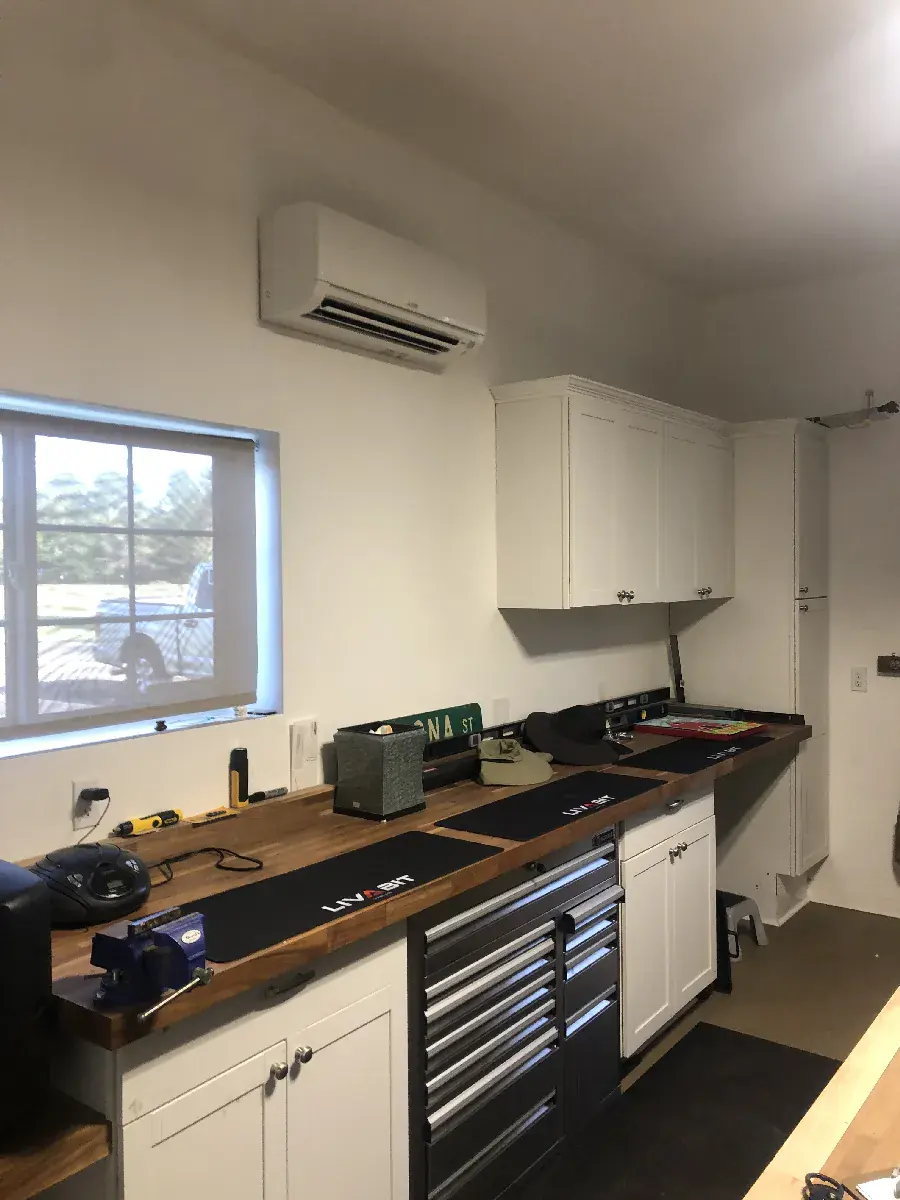 Ductless mini-split outdoor unit on a mounting bracket