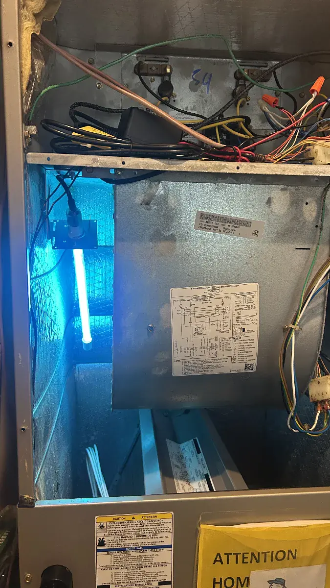 UV coil-sanitizing light installed near evaporator coil